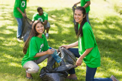 Workers sorting recyclables into separate bins