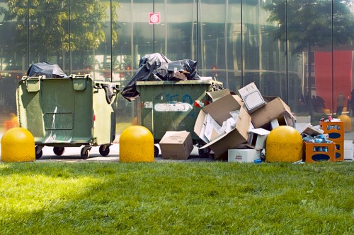 Business waste removal truck driving through Garston